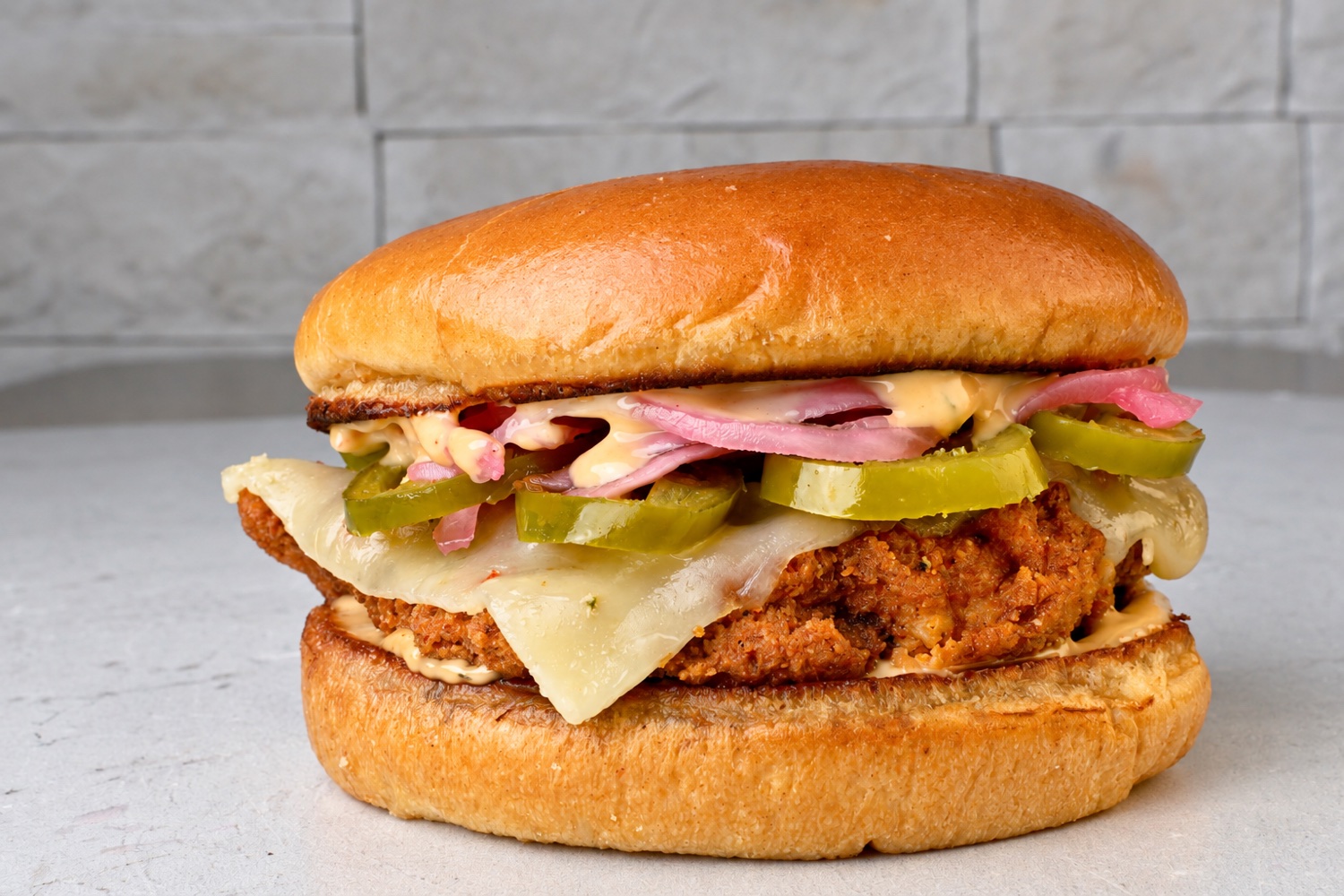 Crispy chicken sandwich with pickles and sauce